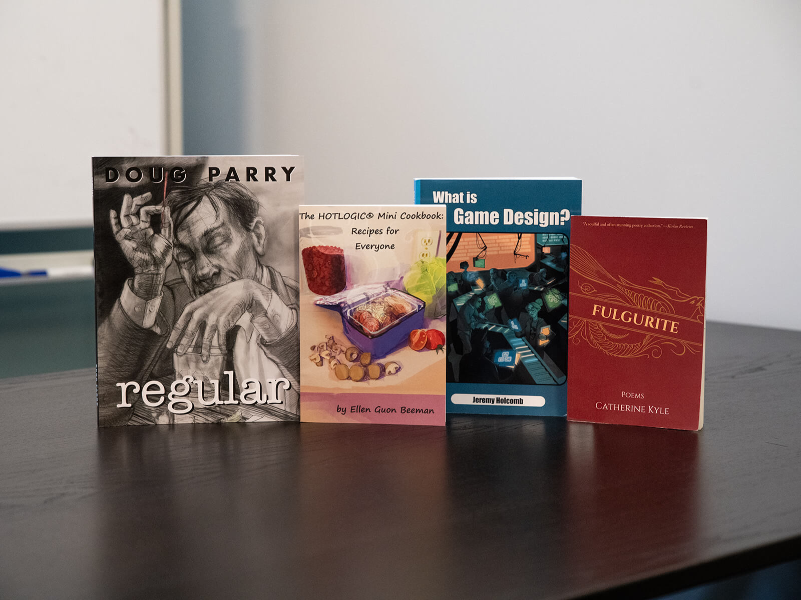 A row of 4 books written by DigiPen faculty.