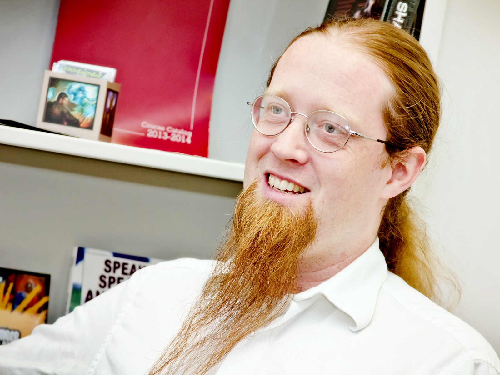 DigiPen game design lecturer Jeremy Holcomb smiling in his DigiPen office