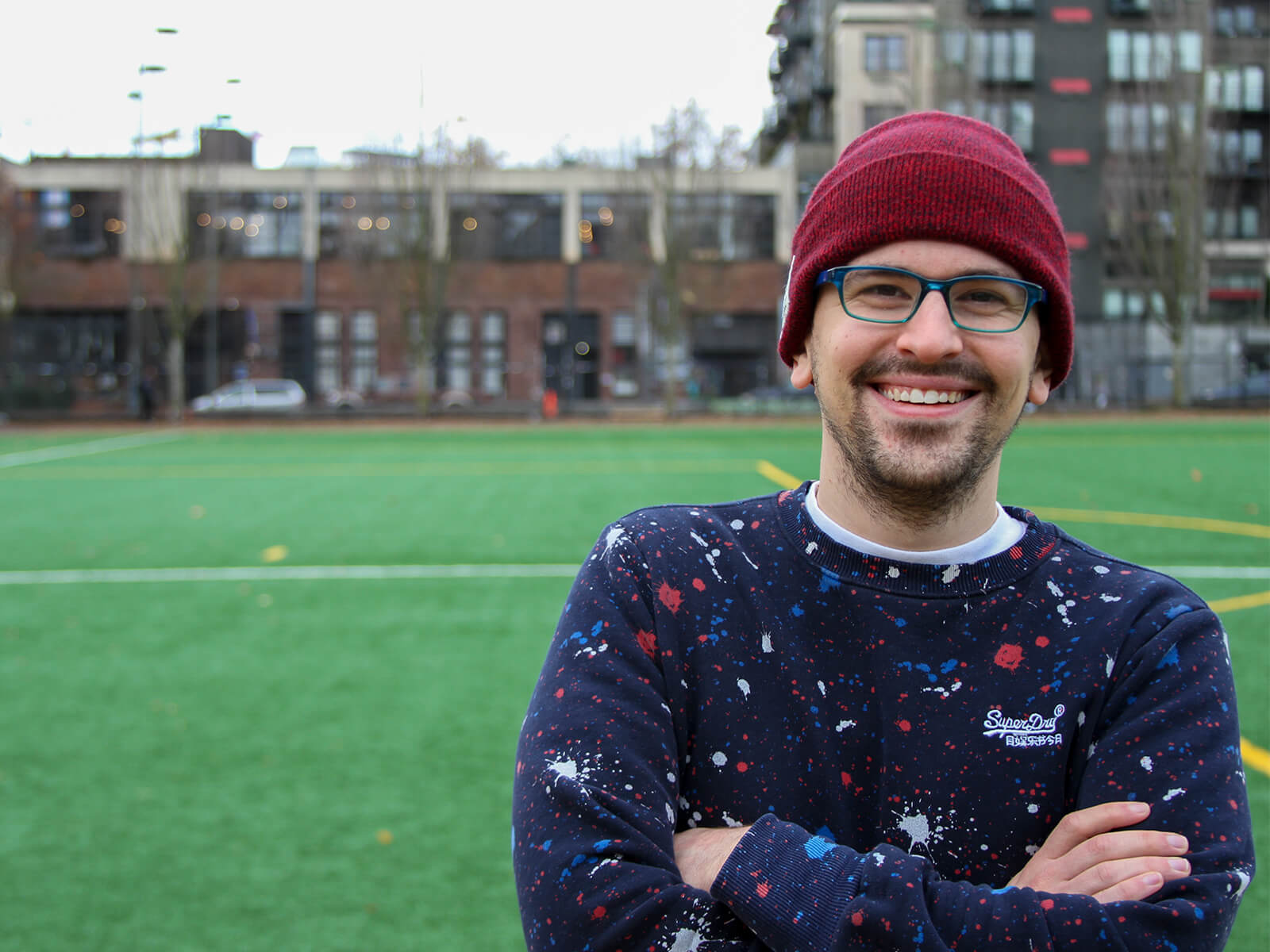 DigiPen game design graduate Logan Fieth smiles for the camera in Seattle’s Cal Anderson Park.