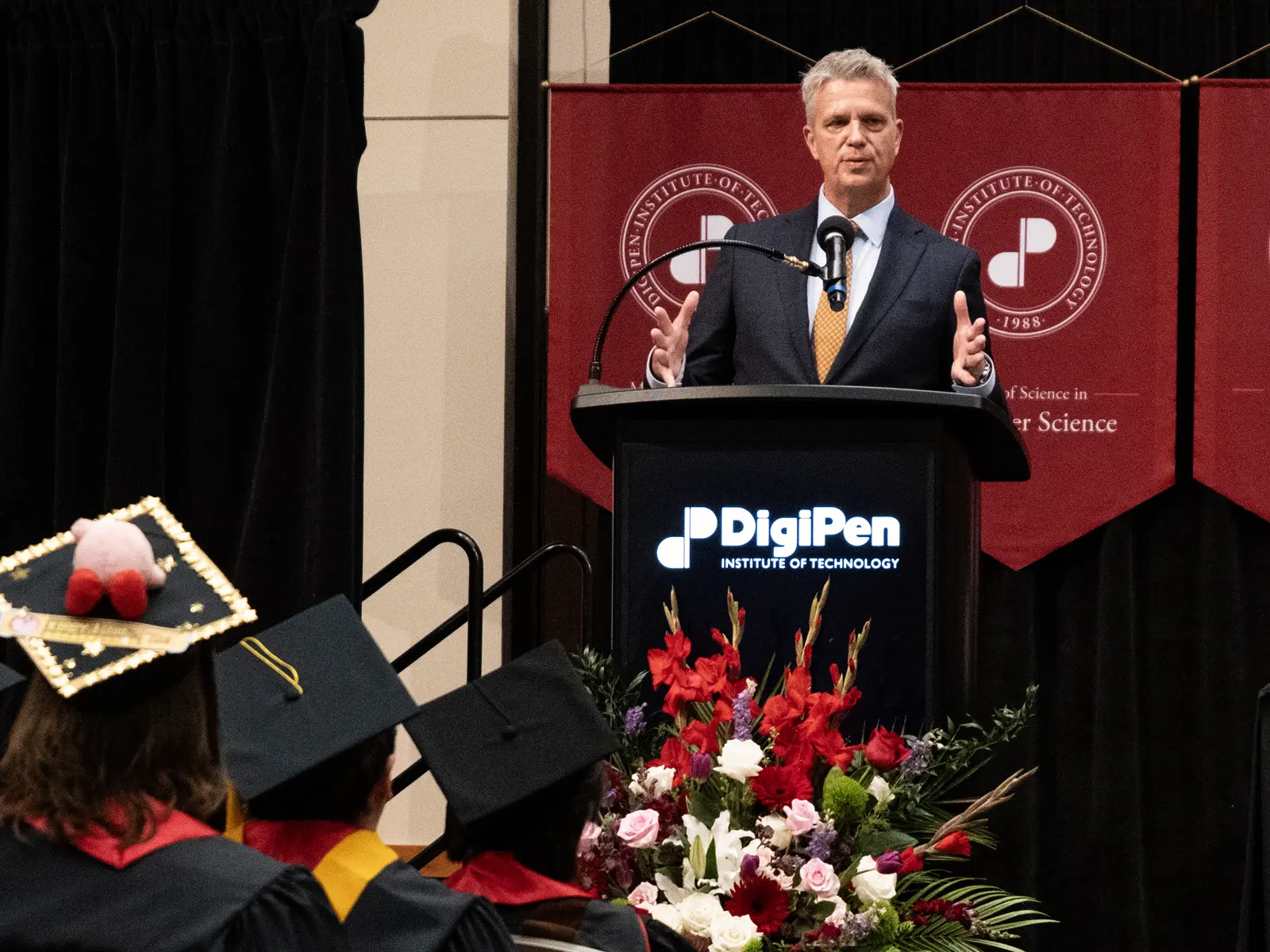 Commencement speaker addresses a crowd of graduates.