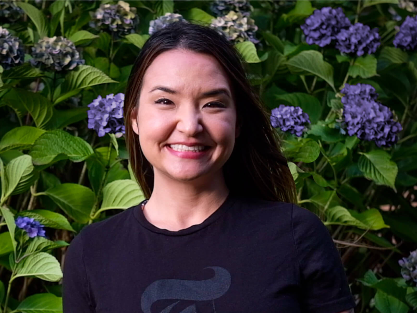 DigiPen graduate Romina Barrett wearing a New York Times logo t-shirt.