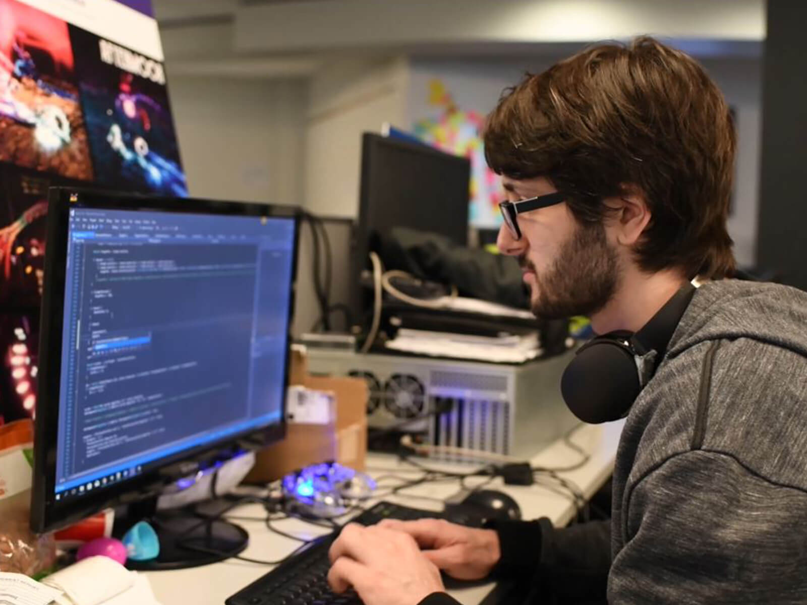 Tristan Begin works at a computer in a DigiPen lab