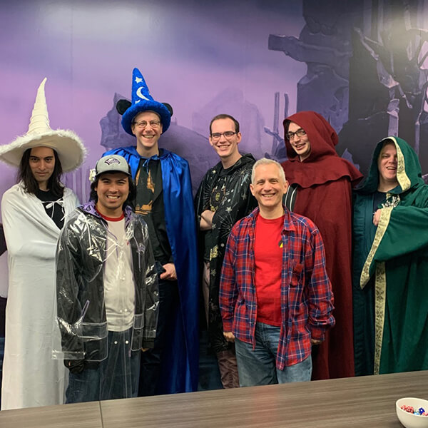 Corey Bowen and fellow Council of Colors members pose wearing variously colored wizard robes.