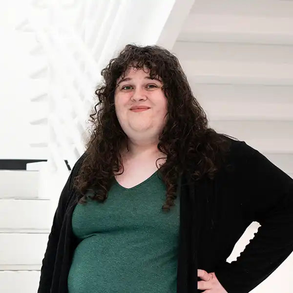 Kiera Williams smiles in a DigiPen campus stairwell.