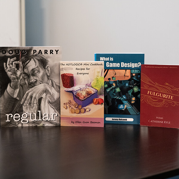 A row of 4 books written by DigiPen faculty.