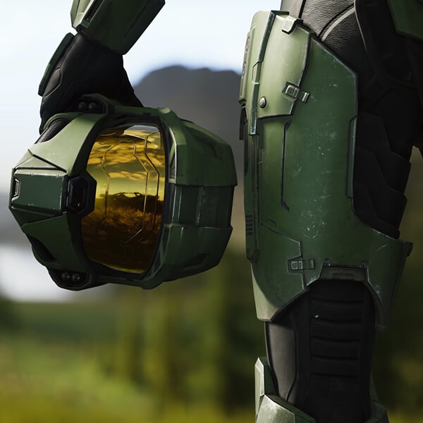 A Halo Infinite screenshot of Master Chief holding his helmet at his waist.