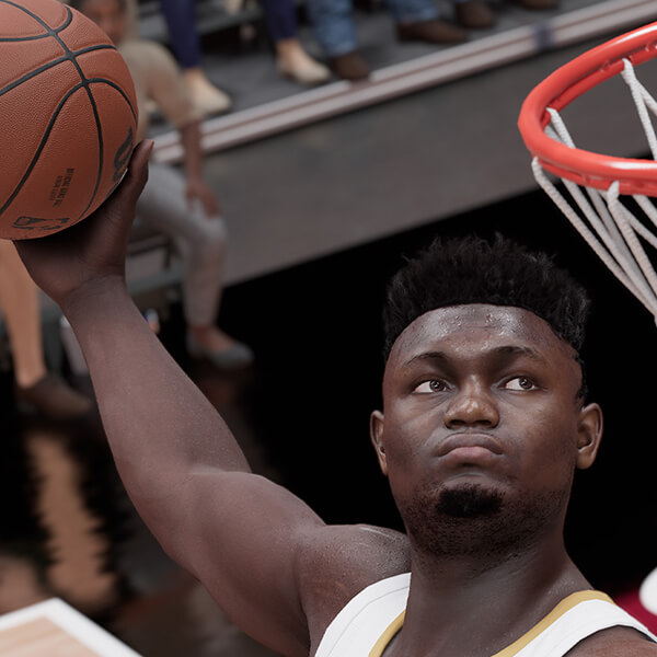 Zion Williamson from NBA 2K23 mid-air preparing to make a slam dunk.