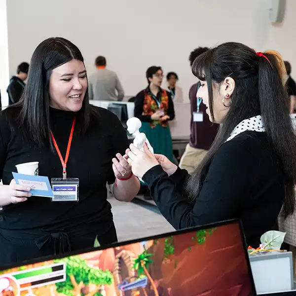 Two NextGen guests converse.
