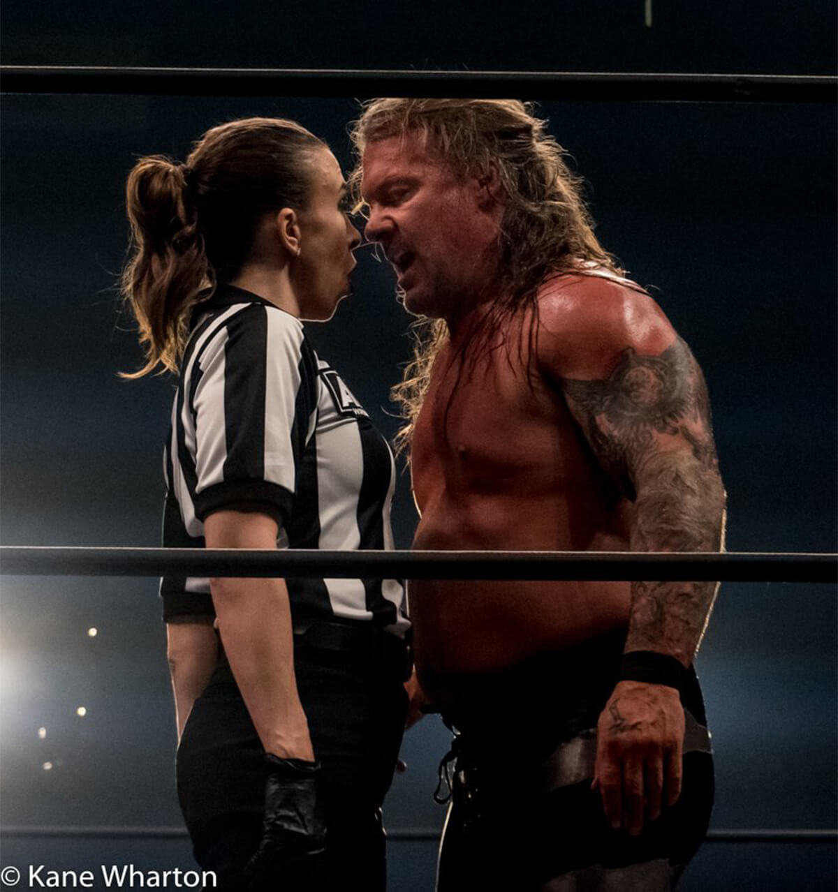 Referee Aubrey Edwards and wrestler Chris Jericho get in each other’s faces during an argument in the ring.