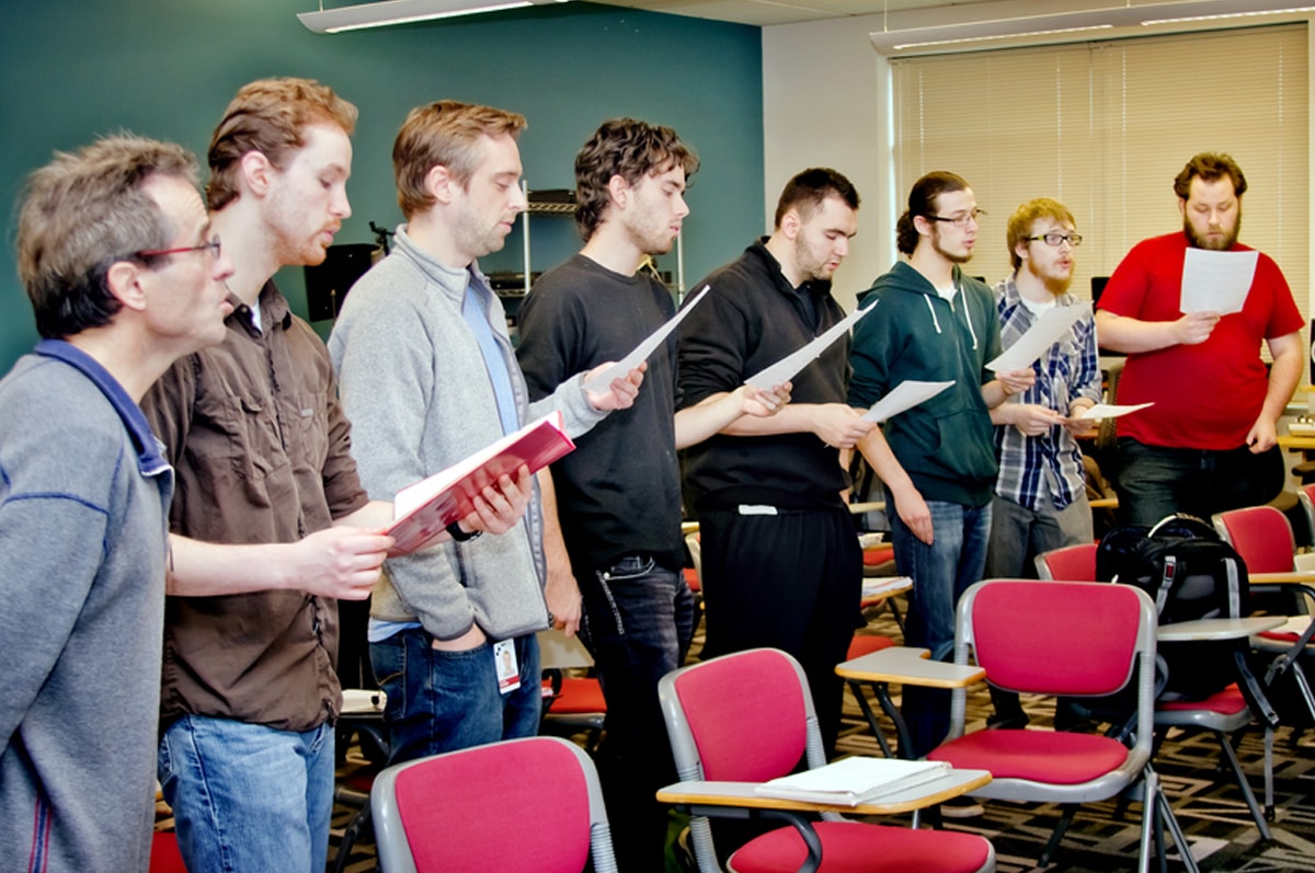 Bruce Stark singing with a group of DigiPen students