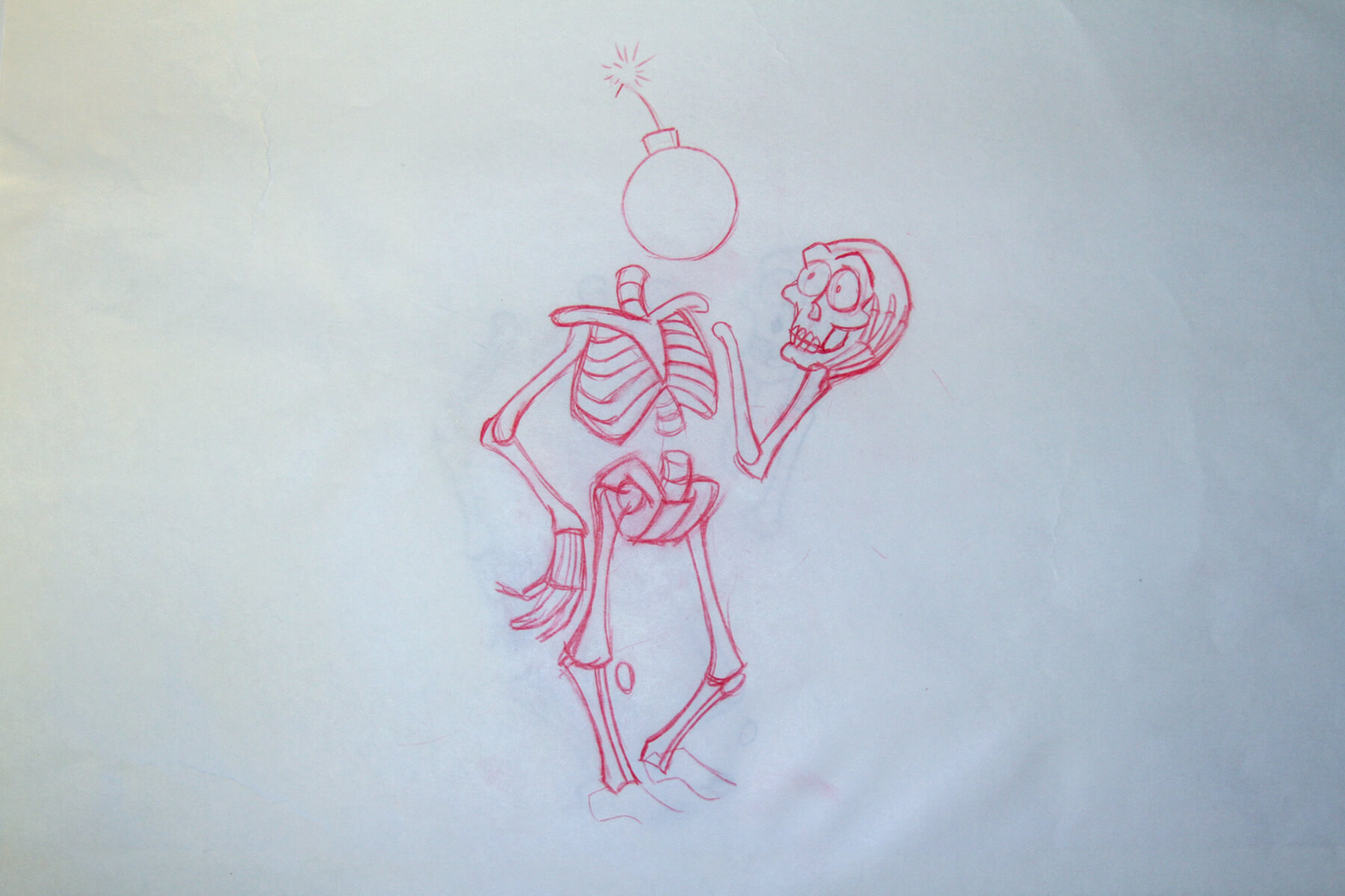 A red drawing of a skeleton, holding it's skull, with a bomb where its head should be.
