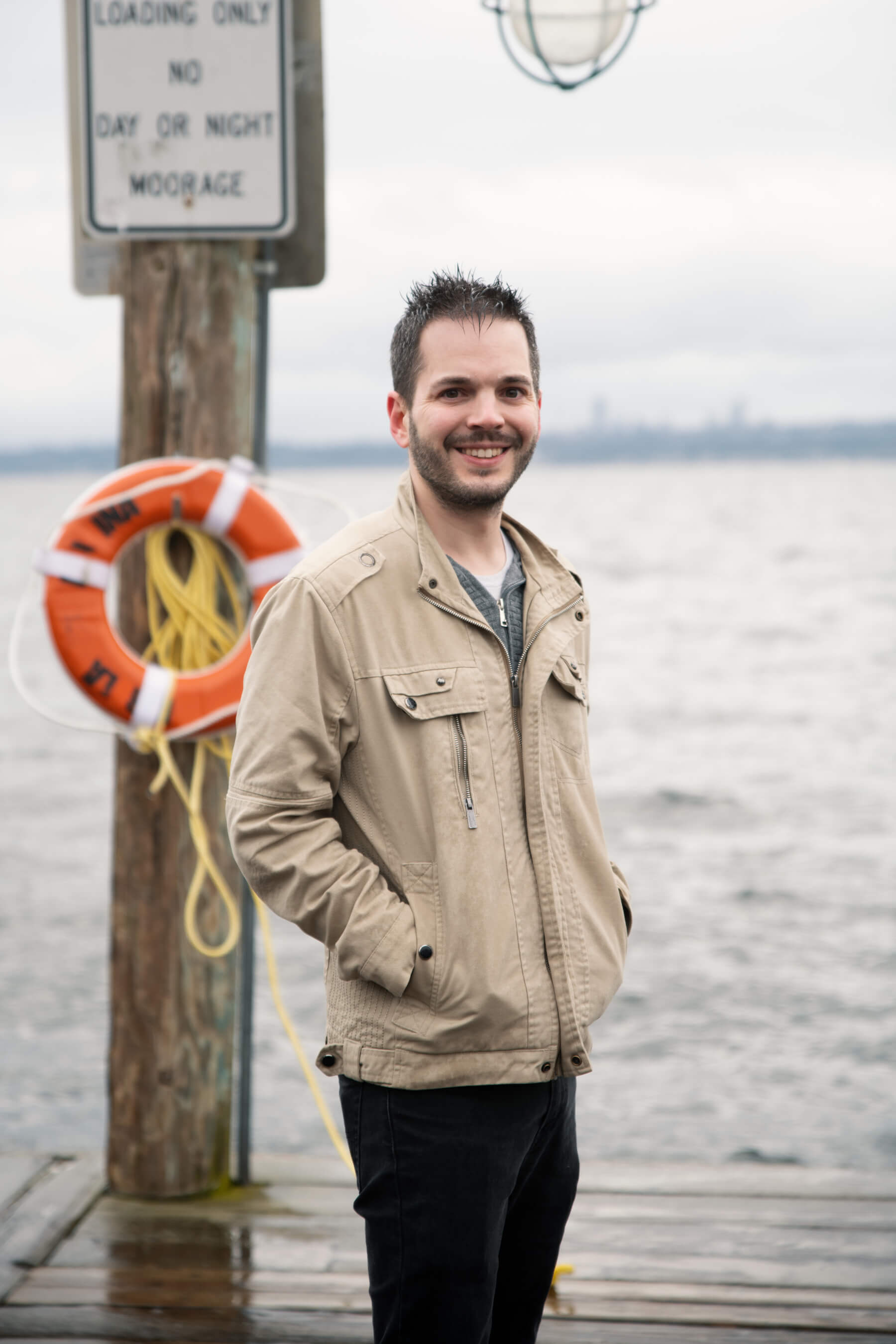 David Evans stands at the end of a lake dock.