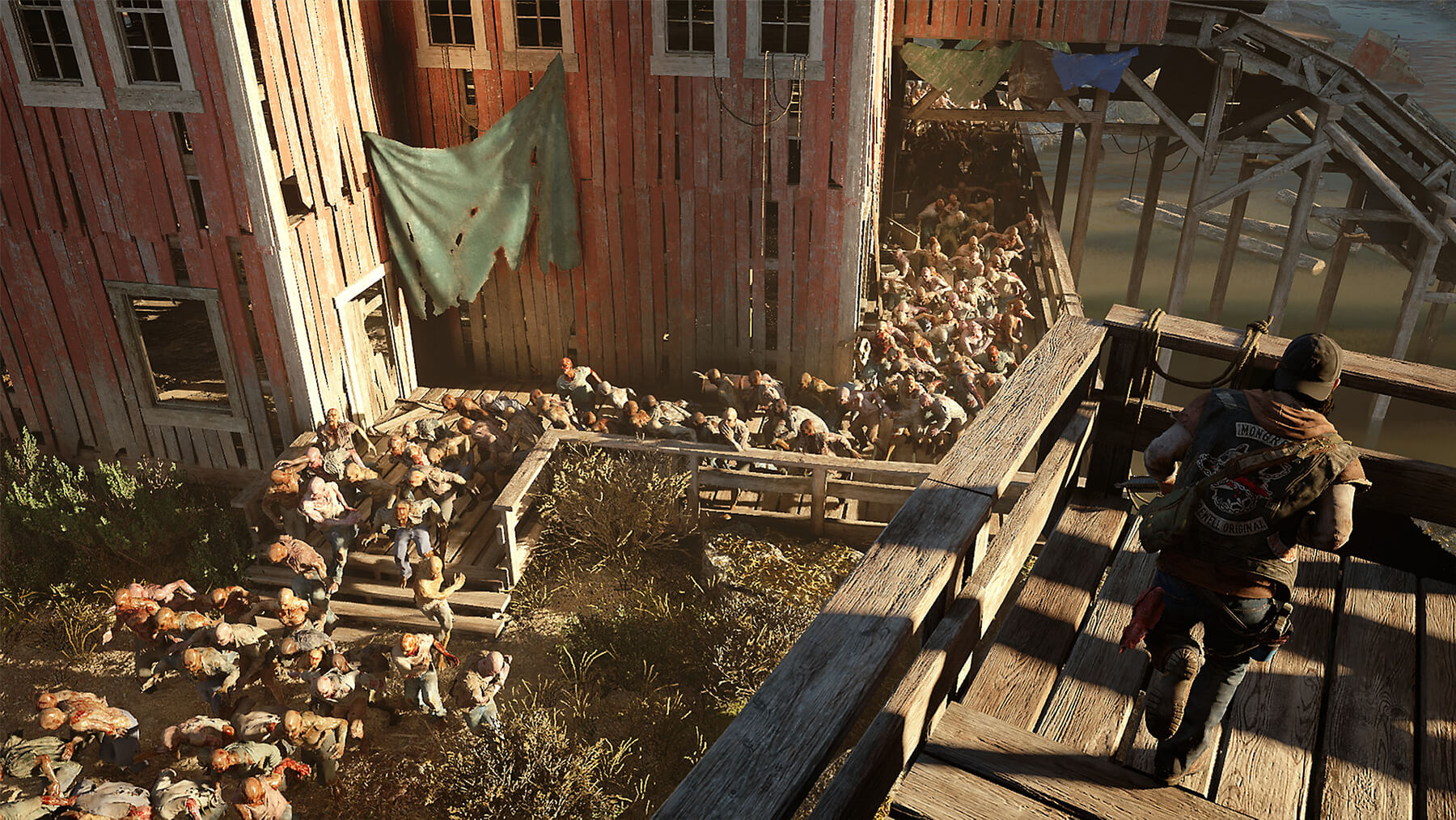 A man overlooks a large crowd of zombies.