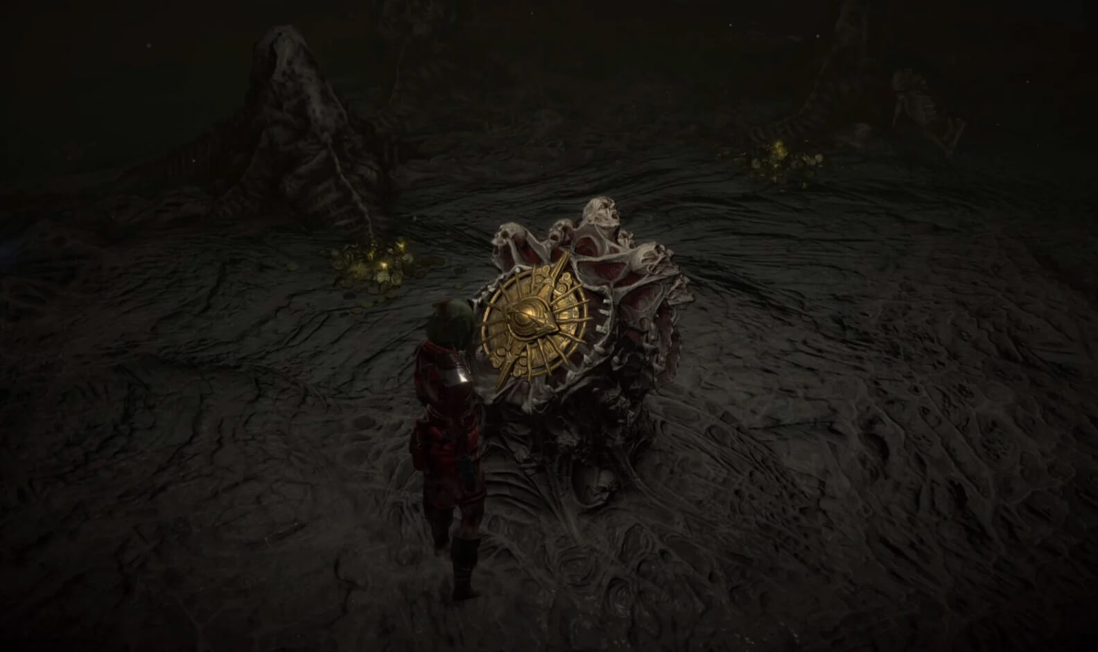 A Diablo IV character approaches a gold relic enshrined in a decrepit mass of heads and skulls.