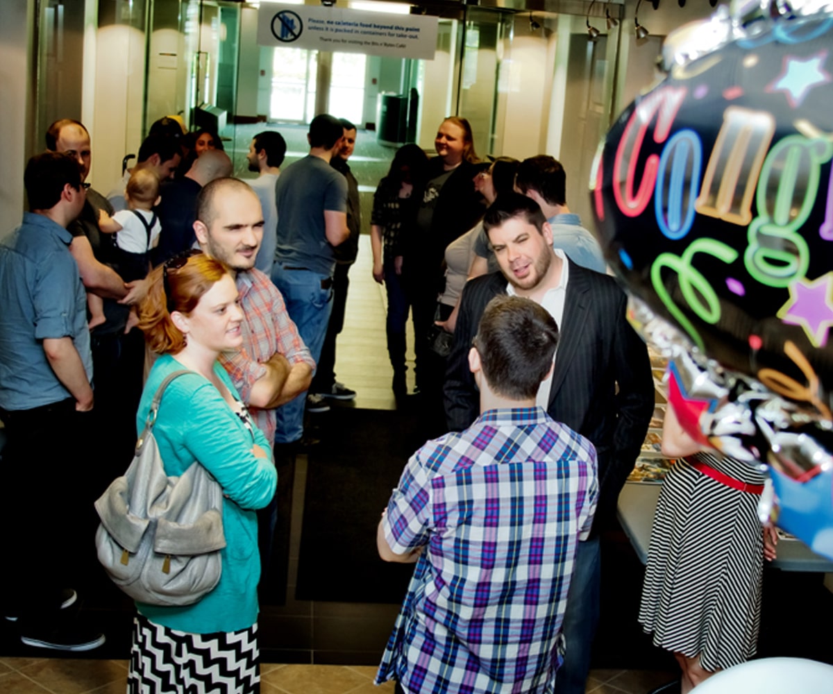 Alumni chat outside the DigiPen cafe