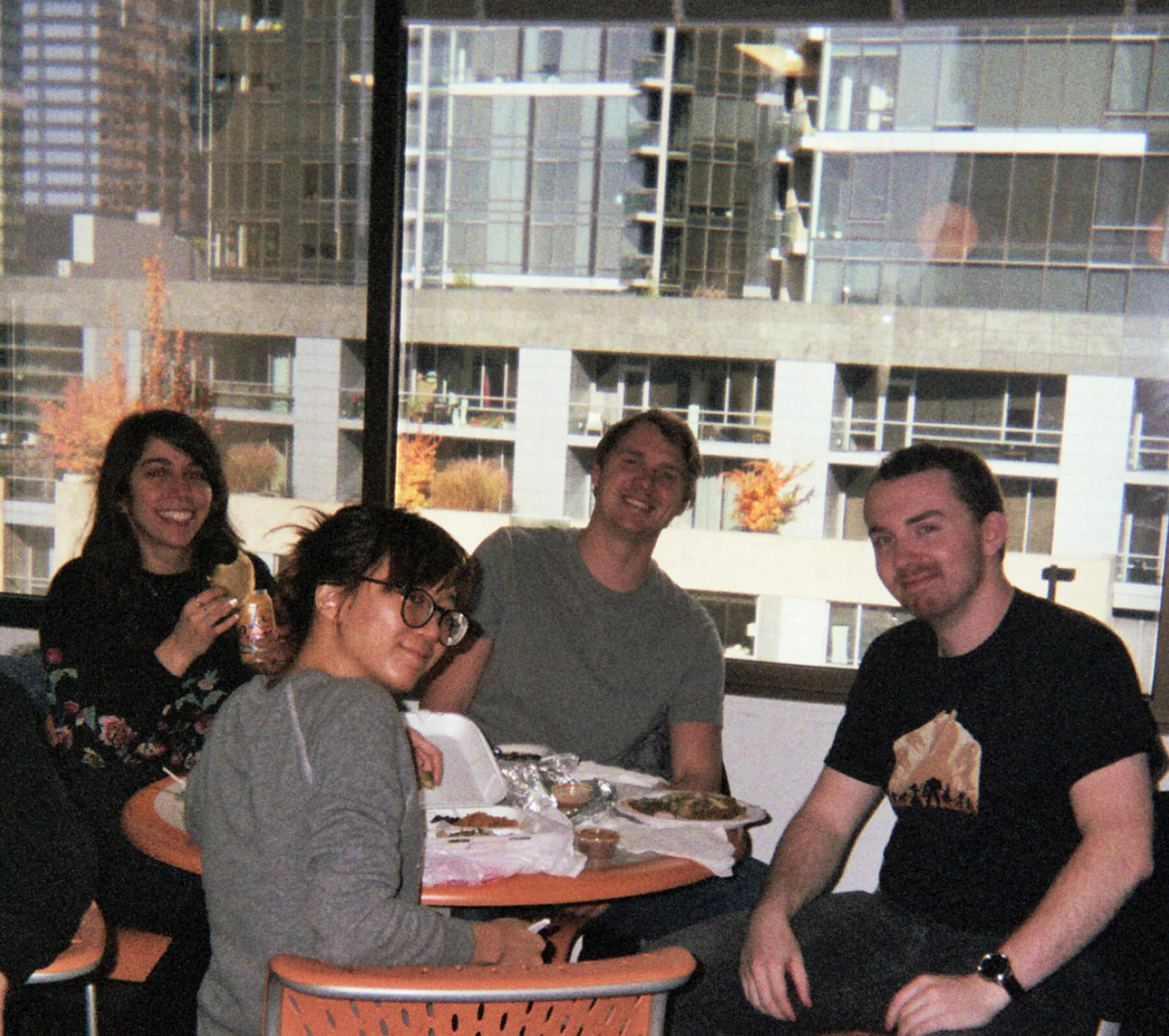 Alumni Yara Abou Samra, Nitsiri Anamwathana, Brett Cunningham, and Nate Messanna share a lunch break at Camouflaj.