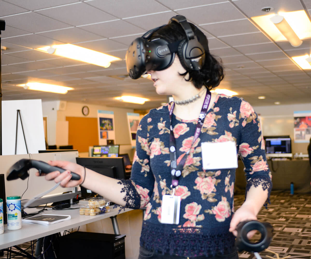 A DigiPen student demonstrating her virtual reality game