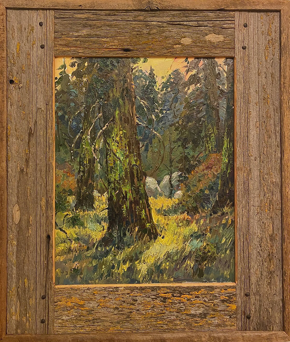 A wood-framed painting of a mossy forest.