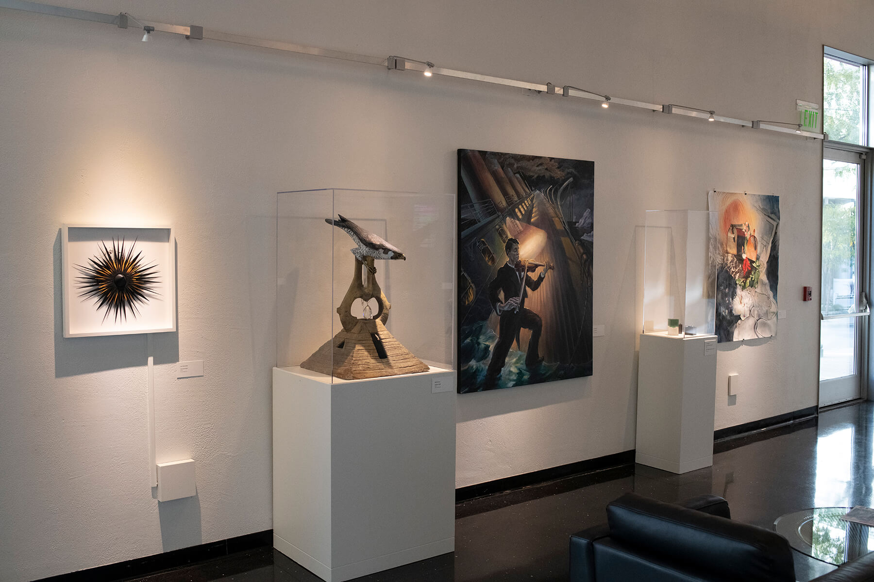 Various abstract and representational faculty art pieces on display at the Bellevue Art Museum.