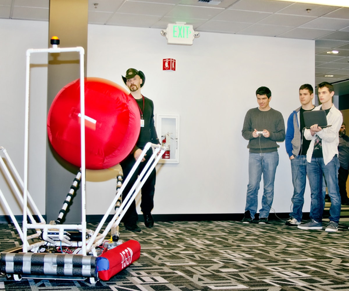 First draft team evaluates new flexible chassis framework by throwing ball into robot arms