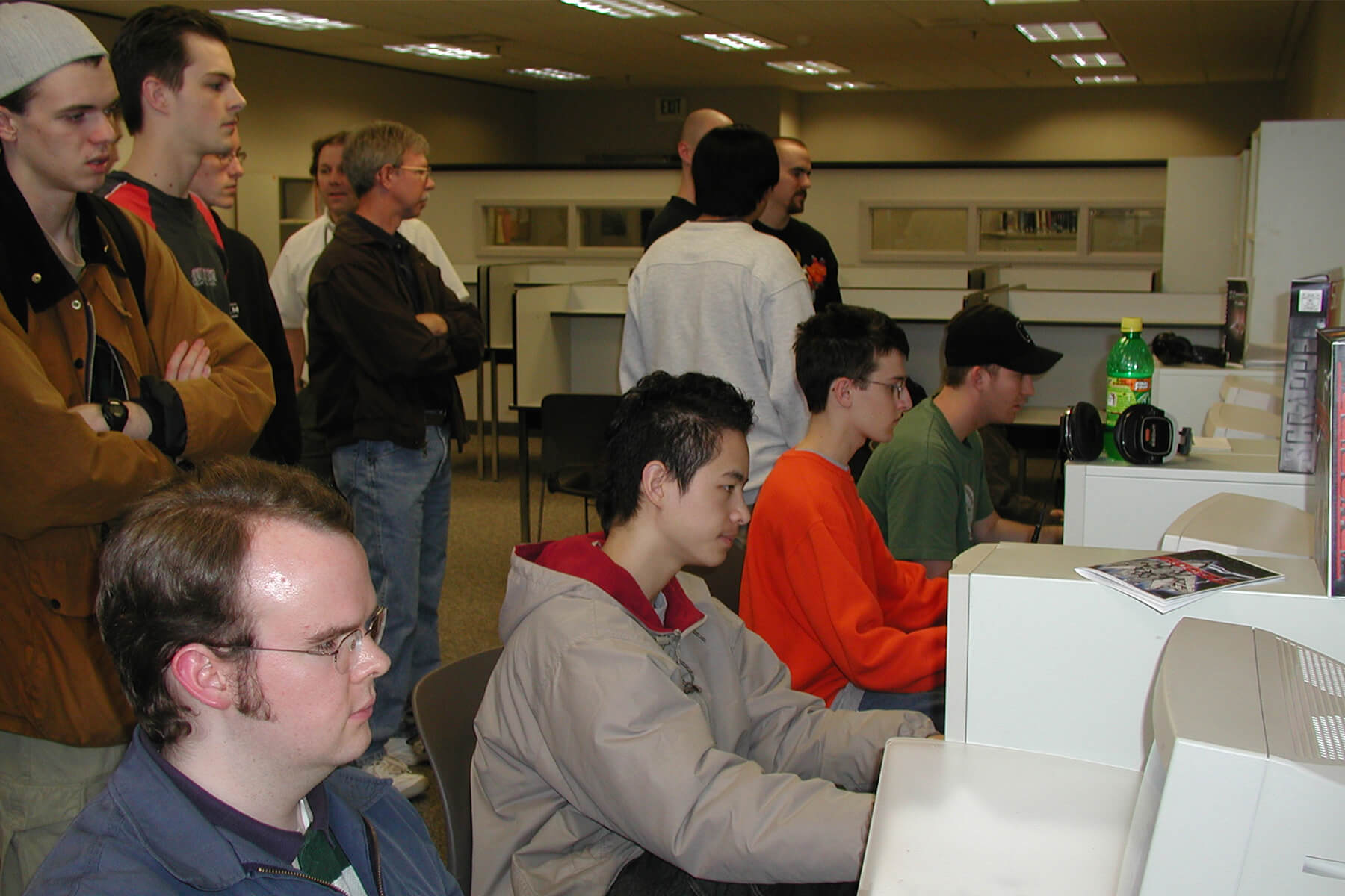 Students and instuctors looking at computer screens.