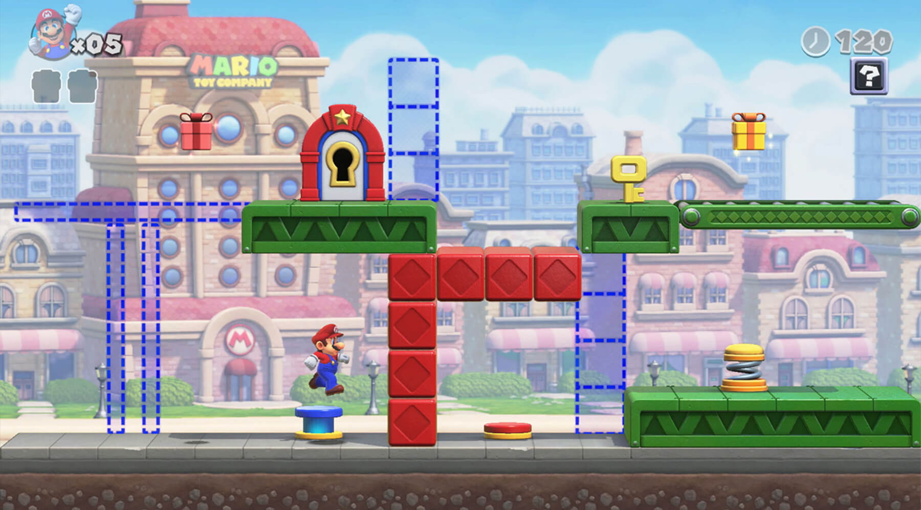 Mario jumps on top of a blue button in a screenshot from Mario Vs. Donkey Kong for the Switch.
