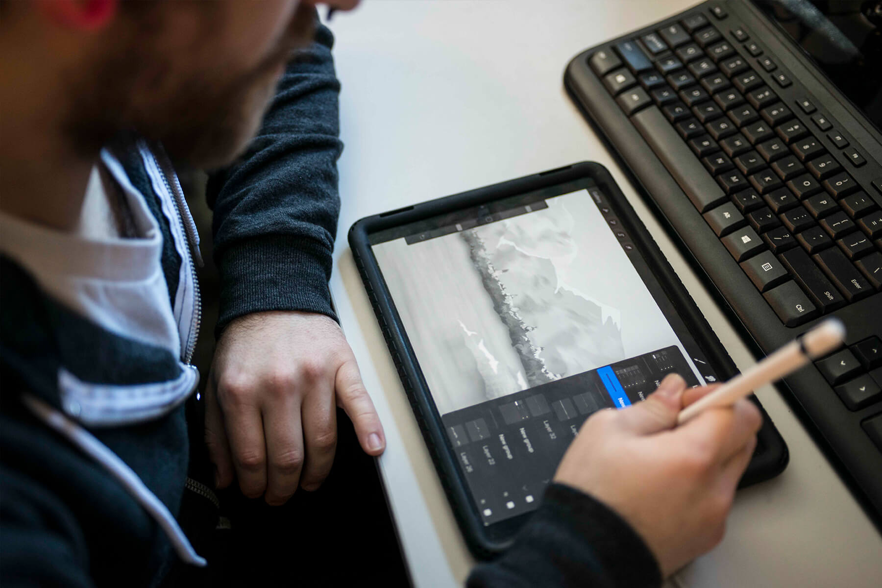 A DigiPen student works on a digital drawing tablet.
