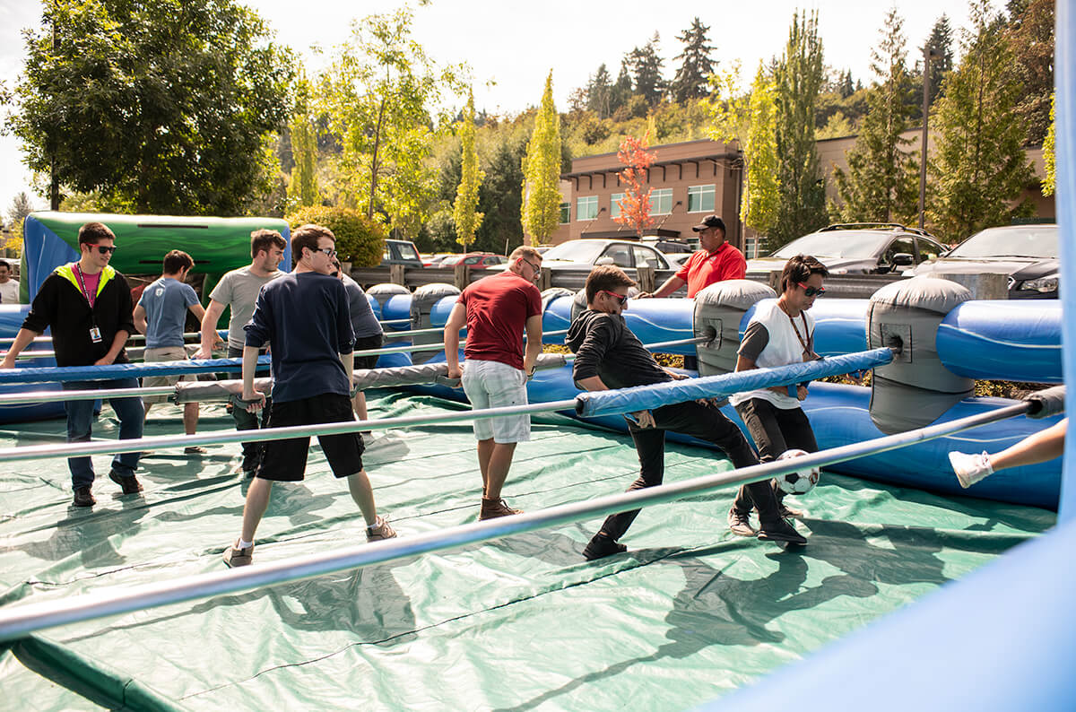 DigiPen students play human foosball on an inflatable court