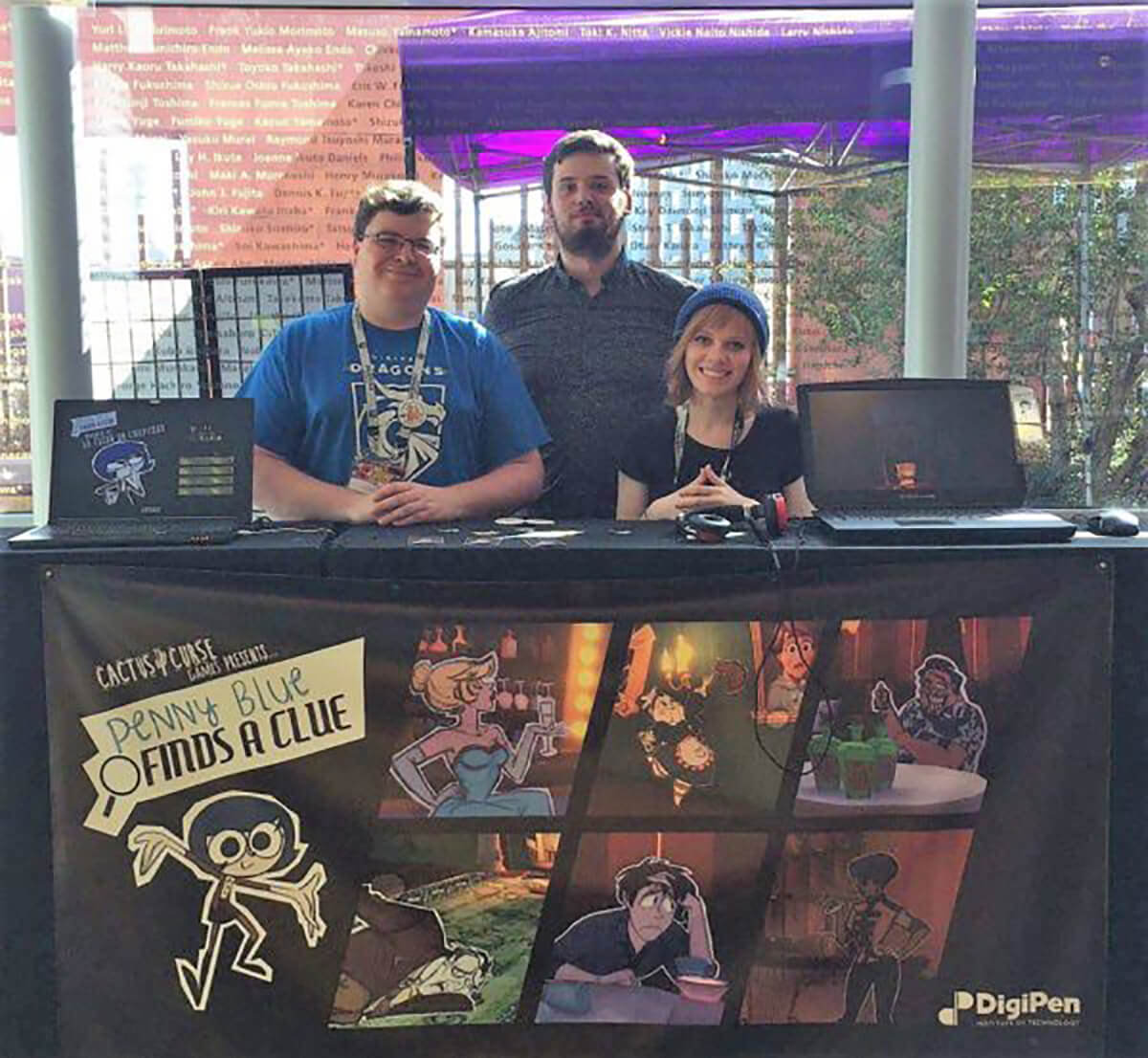 Team Cactus Curse members Garrett Huxtable, Jesse Hibbs, and Lauren Stutzriem pose at their IndieCade 2017 booth