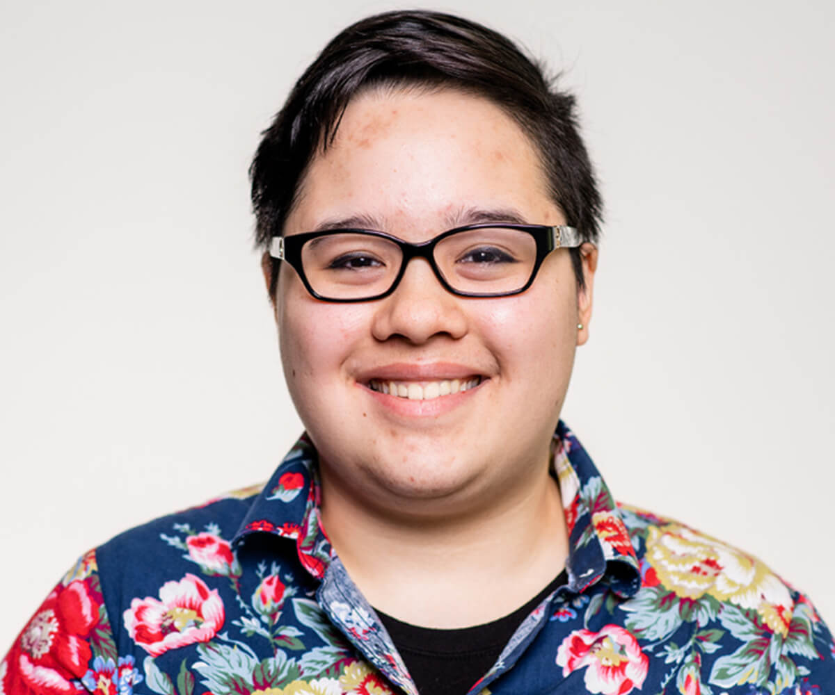 A headshot of DigiPen student Jei Ling, wearing a floral print shirt.