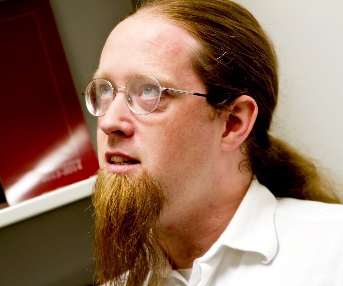 Jeremy Holcomb looks at the ceiling in his office