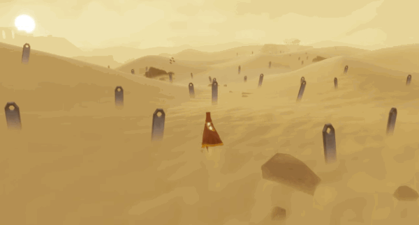 The robed protagonist of Journey wanders the sandy desert. 