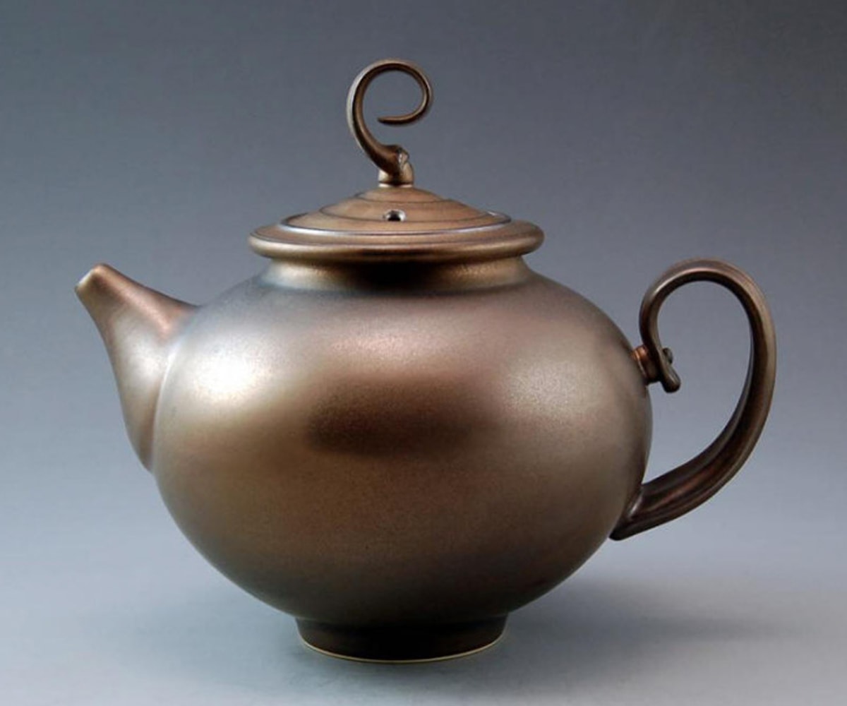 Bronze-colored teapot sculpted by Ken Turner