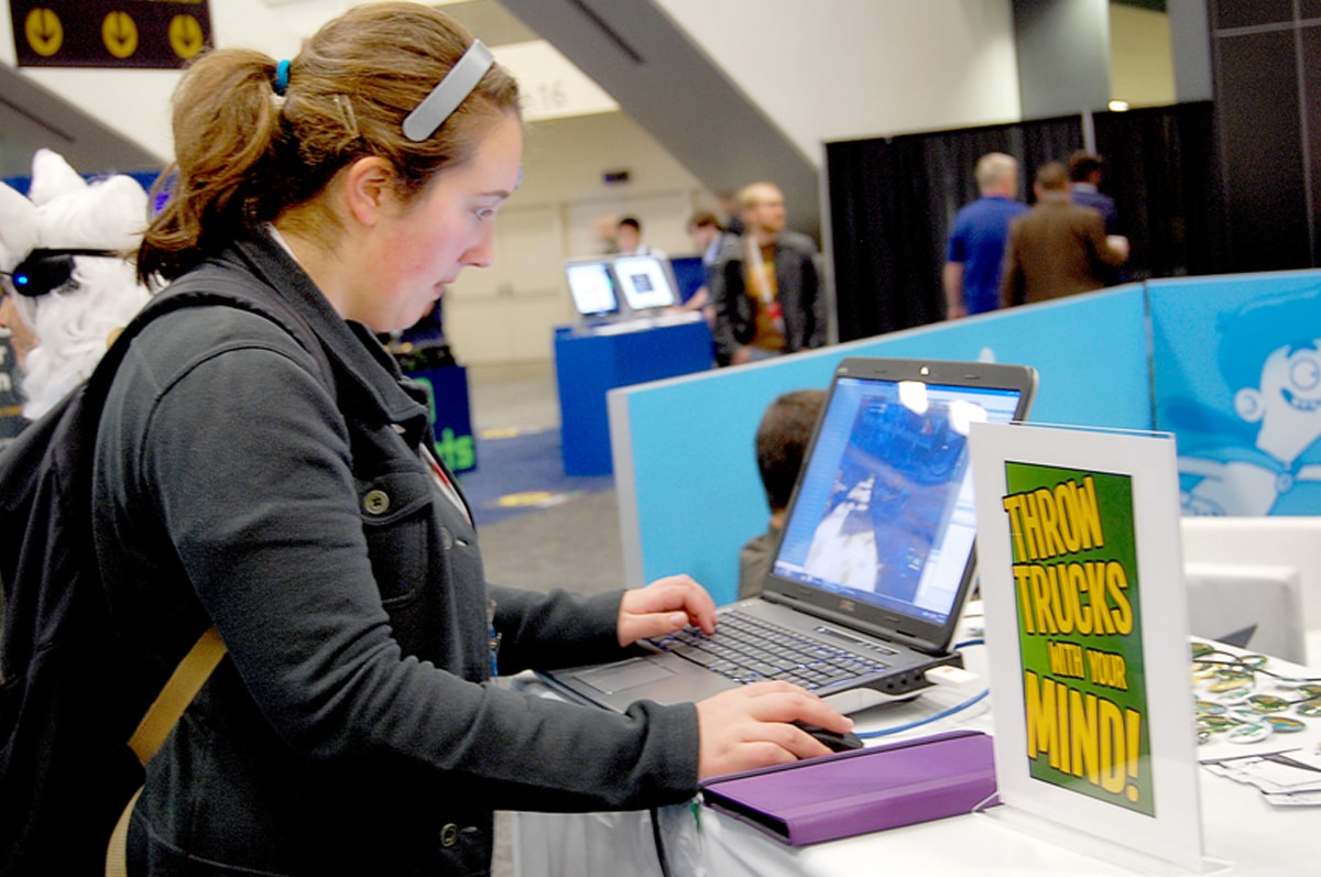 A Game Developers Conference attendee interested in playing Throw Trucks With Your Mind