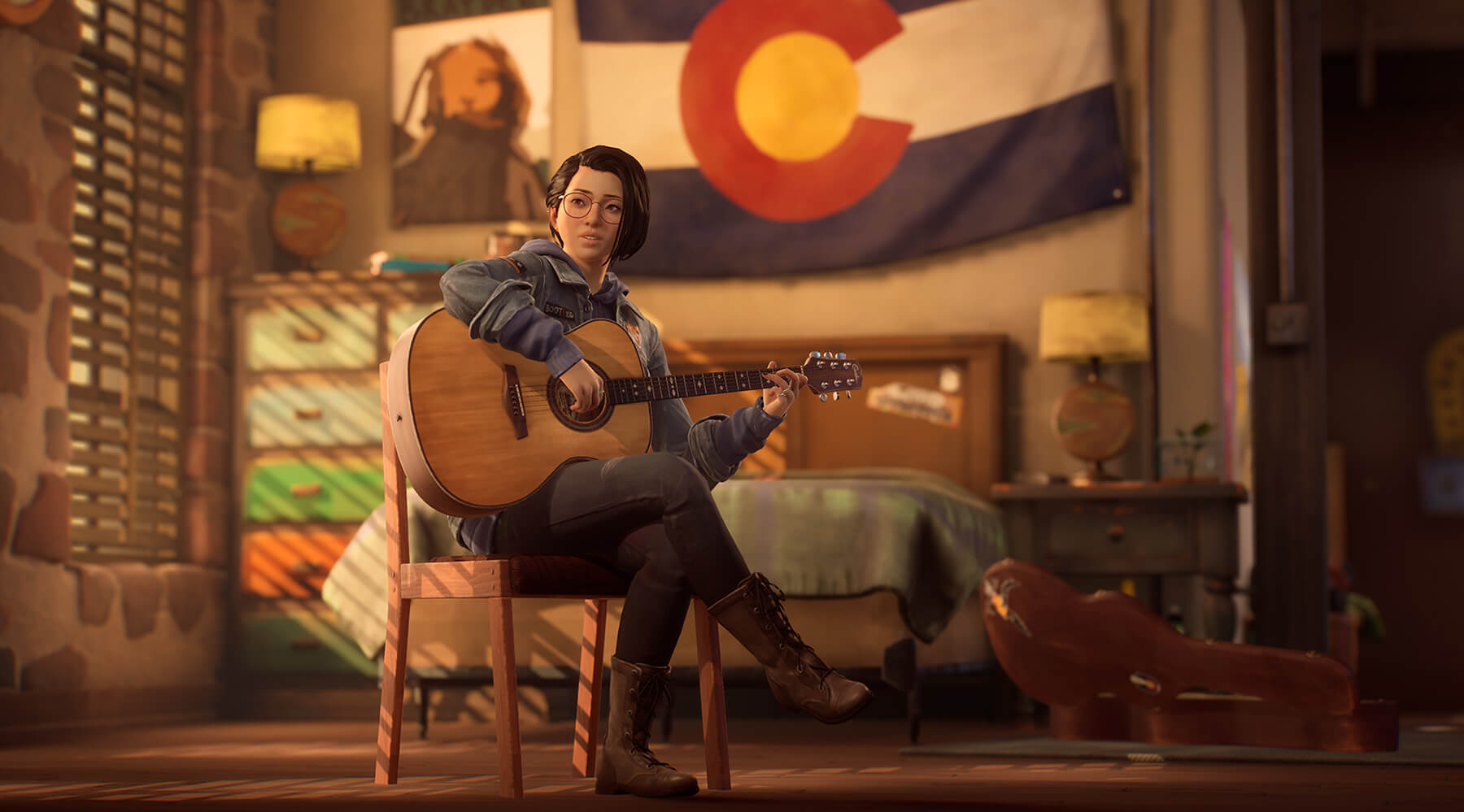 A screenshot of Alex Chen playing guitar in front of a Colorado flag.