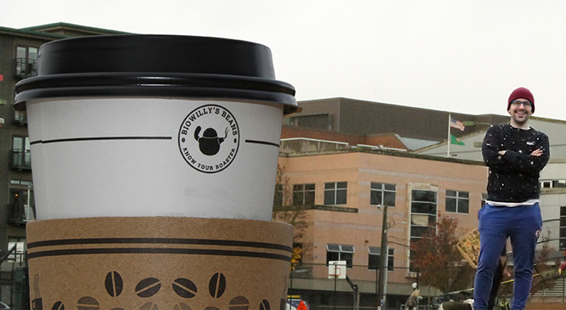 Fieth poses next to an enormous coffee cup.