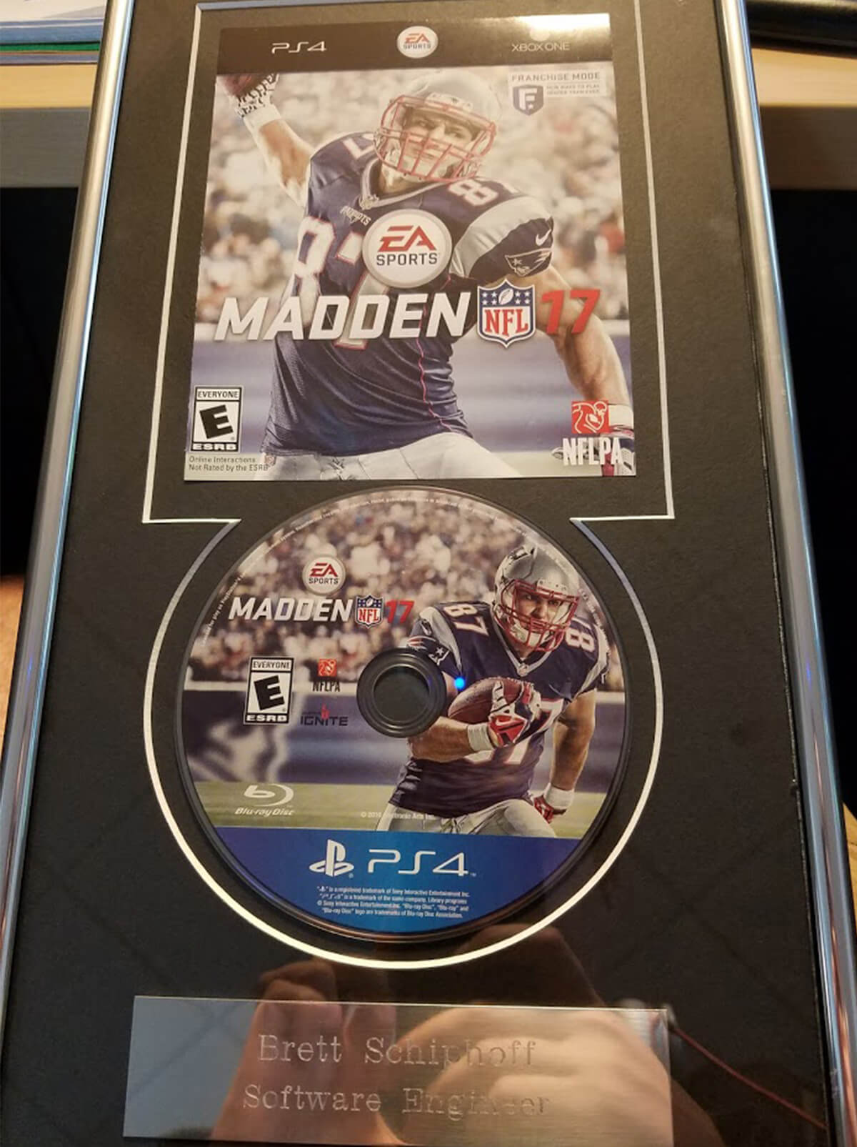 A picture of a commemorative plaque Brett Schipoff received for shipping Madden NFL 17.