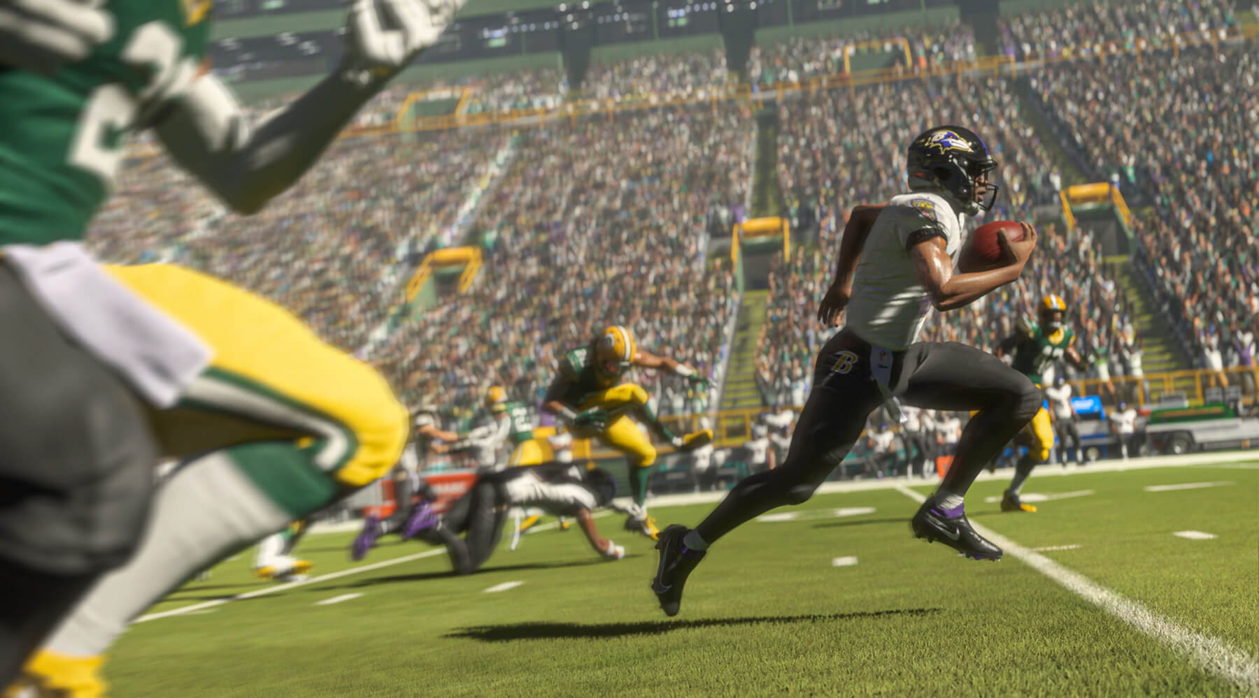 A screenshot from Madden NFL 21 showing the Baltimore Ravens running the ball.