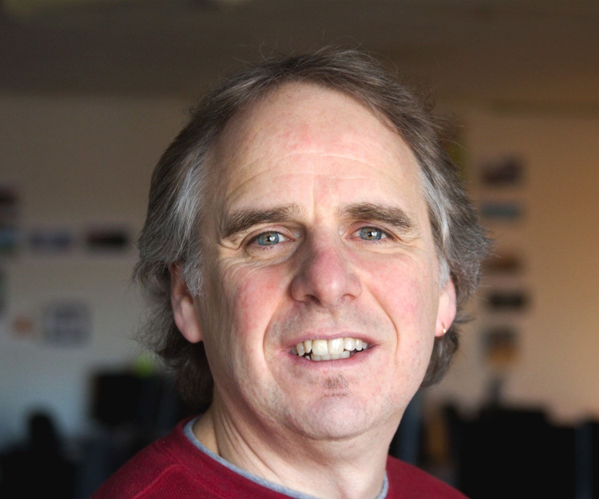 Portrait of Mark Henne smiling in his DigiPen office