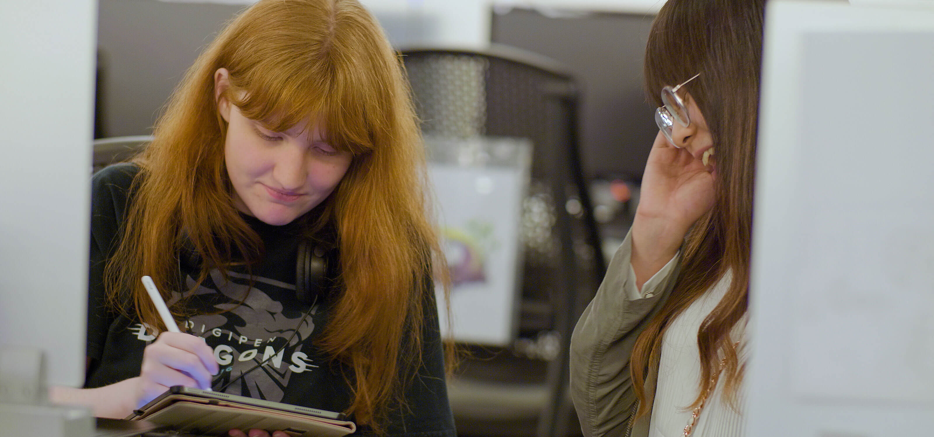 A student works on a tablet in a DigiPen lab