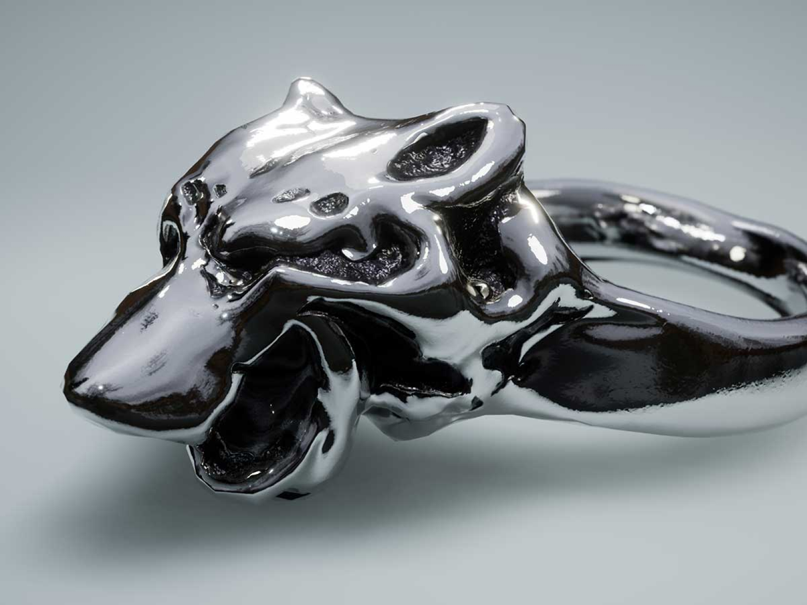 3D model of an dark silver ring with a wolf head on it
