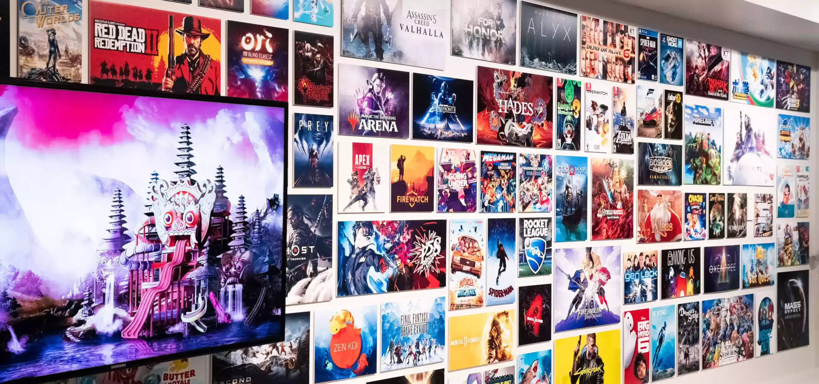 Picture of the Alumni wall at the DigiPen campus, featuring posters of projects that alumni have worked on