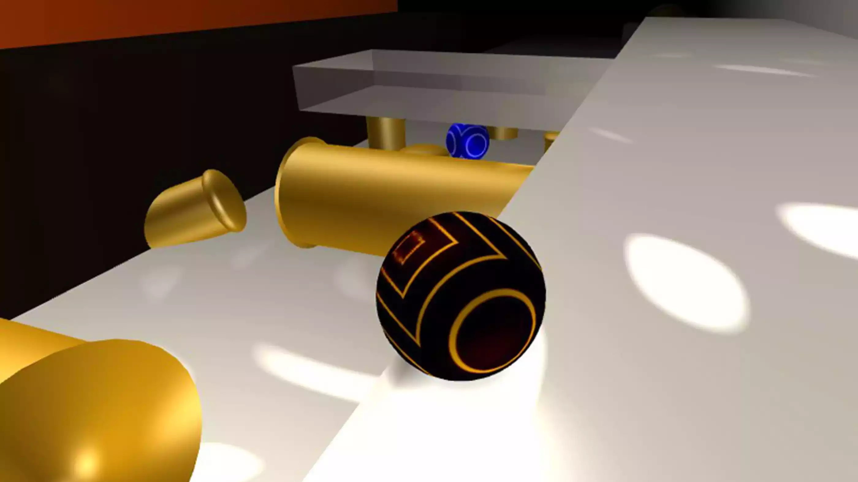 A black ball sits on a white plane with gold tubes below it and a blue ball in the distance. 