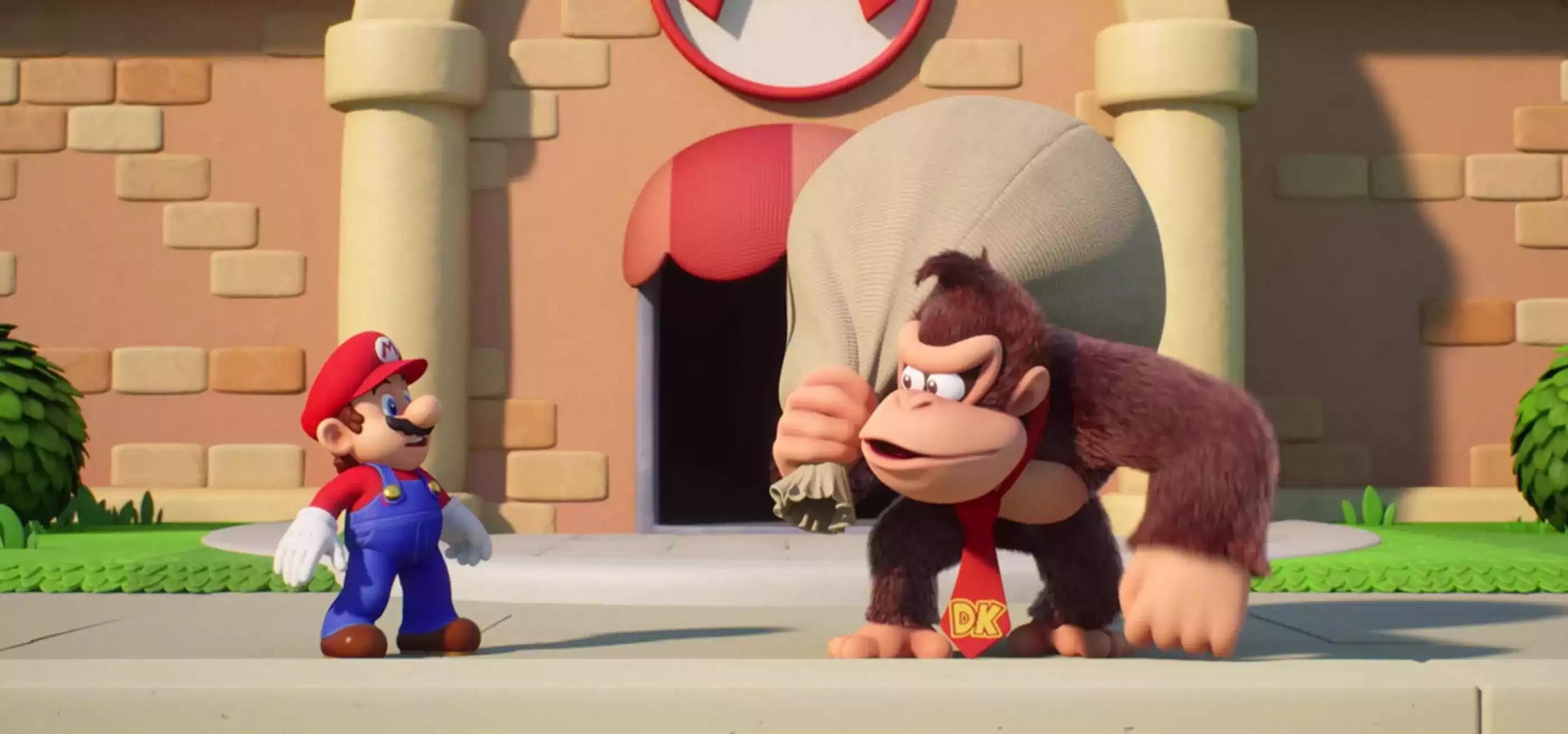 Donkey Kong holds a sack over his shoulder and faces Mario in a screenshot from Mario Vs. Donkey Kong for the Switch.