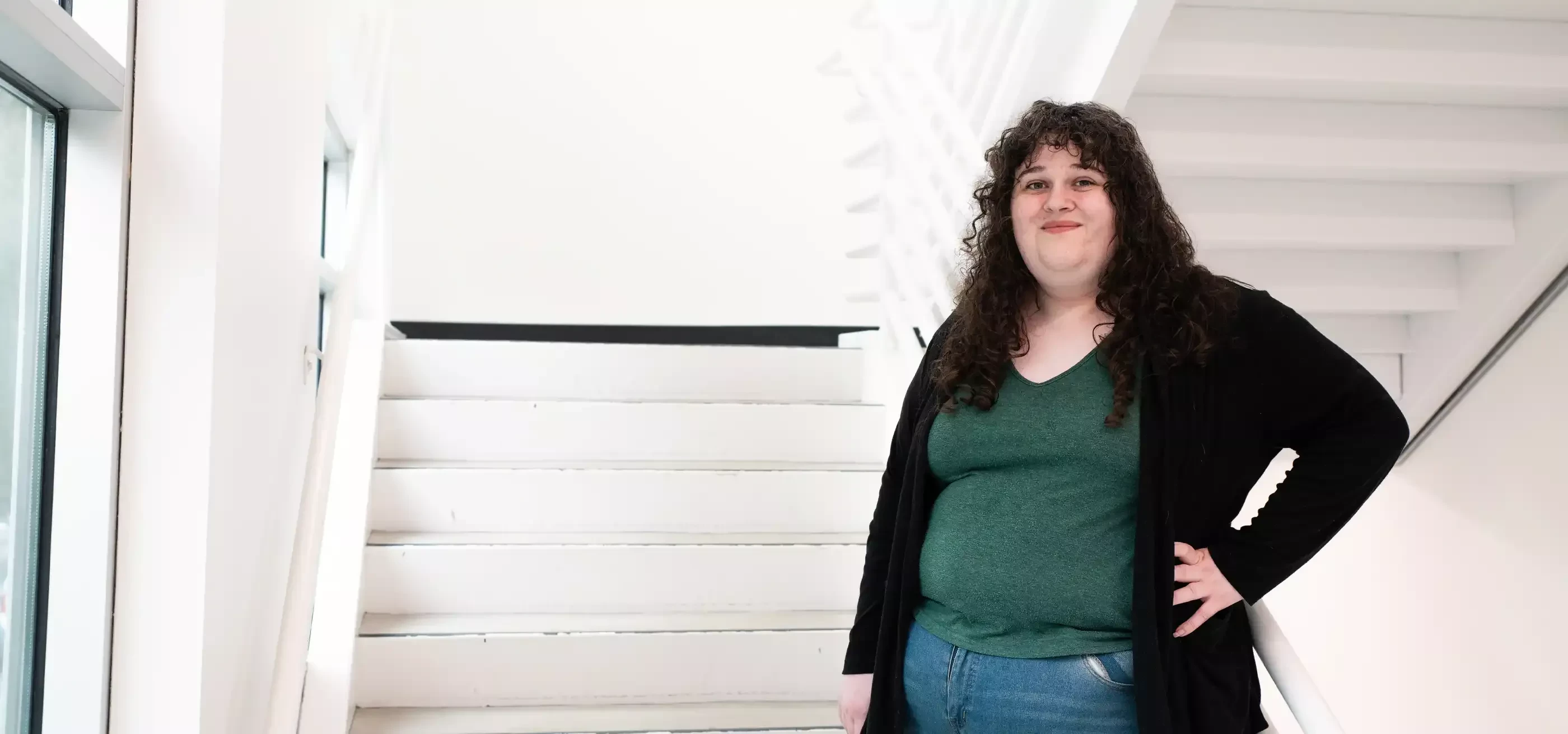 Kiera Williams smiles in a DigiPen campus stairwell.