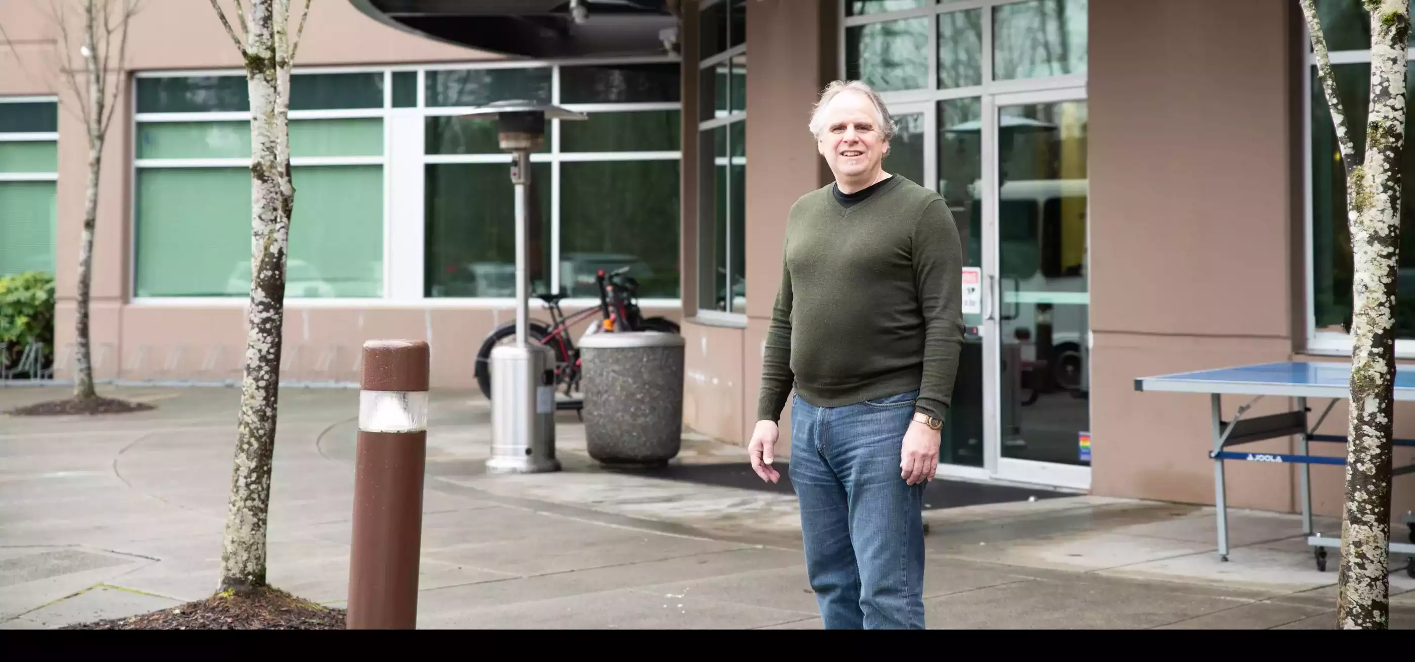 Mark Henne poses in front of the DigiPen main entrance.
