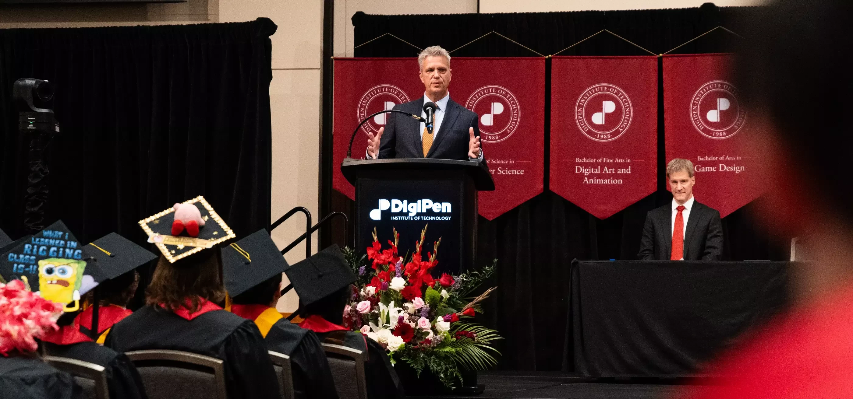 Commencement speaker addresses a crowd of graduates.