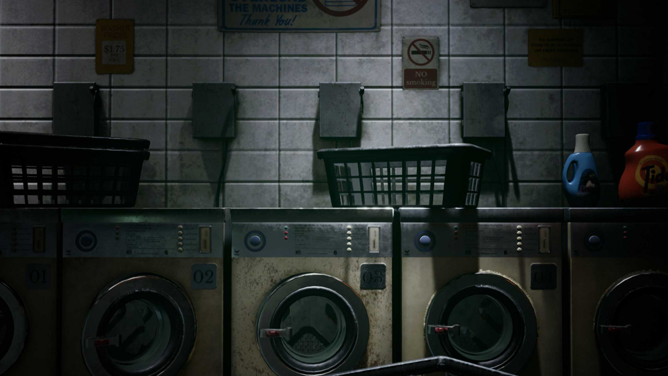 A dark laundromat with empty baskets and laundry cleaning supplies.